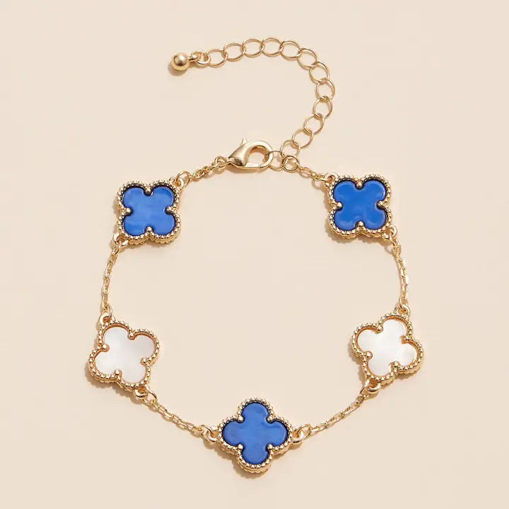 Gold bracelet with blue and white flower charms – Maven Blush Boutique