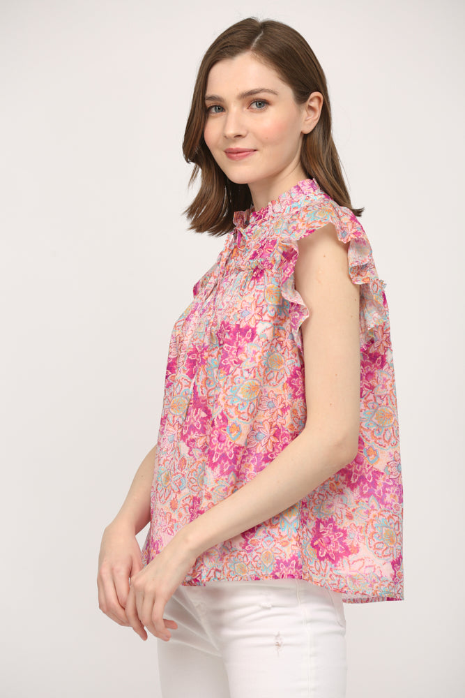 A side angle of the Aelia Floral Ruffle Top by Fate, featuring the ruffle detail on the sleeve and the airy silhouette for a comfortable summer look.