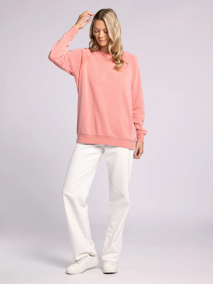 Thread & Supply Hangout Top in strawberry ice. Soft long sleeve crewneck with raglan sleeves, ribbed hem, and cuffs. Relaxed fit and casual style for layering.