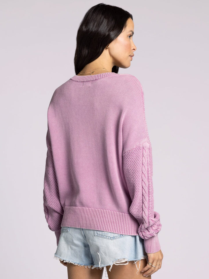 Back view of Thread & Supply Harriet Sweater in soft cotton with a relaxed fit, v-neckline, and classic cable knit detailing.