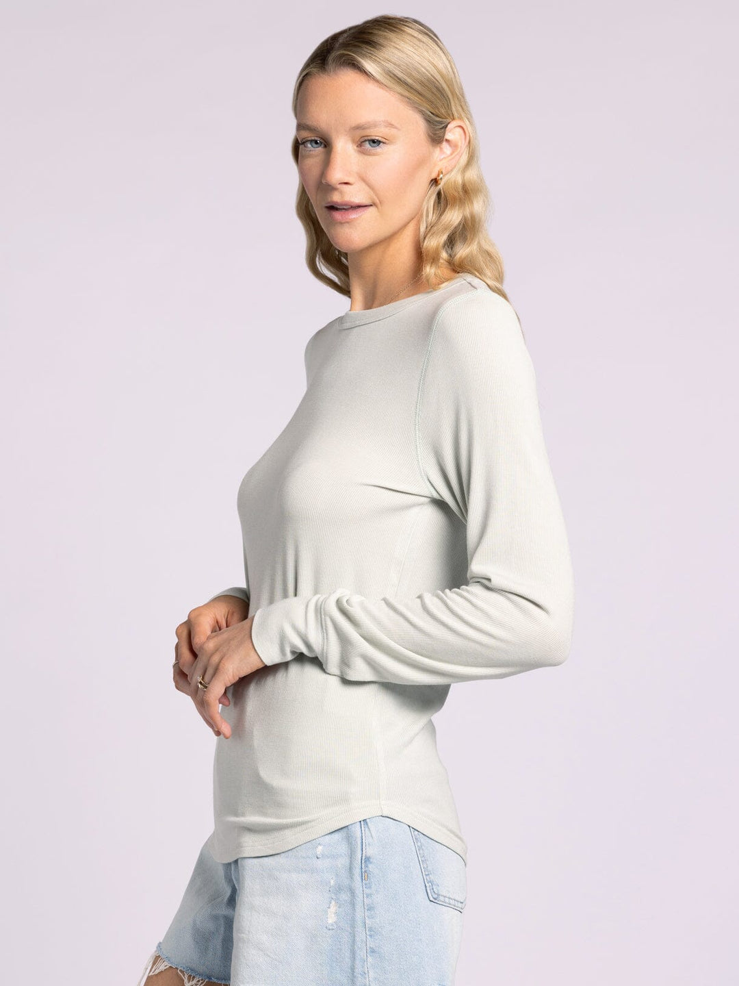 Side view of Thread & Supply Stacy Top in aqua mist. Fine-ribbed, buttery soft long sleeve with a relaxed fit, crew neck, and cuffs. Lightweight and versatile for layering or everyday wear.