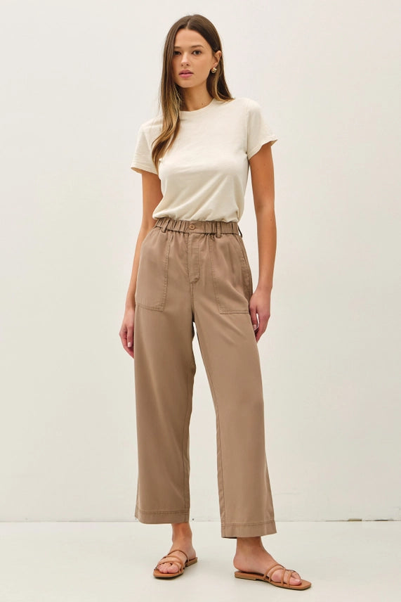 Woman wearing Amorie Wide Leg Tencel Pant with Elastic Waist, styled with a summer tank and sandals.