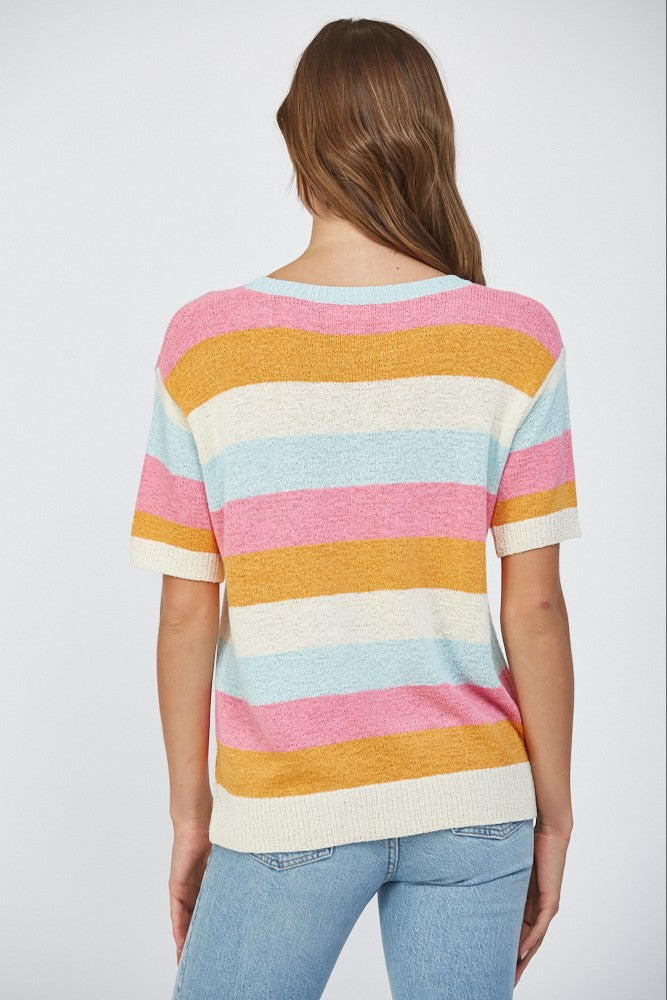 Woman wearing a short sleeve striped lightweight sweater in pink, blue, orange, and off-white