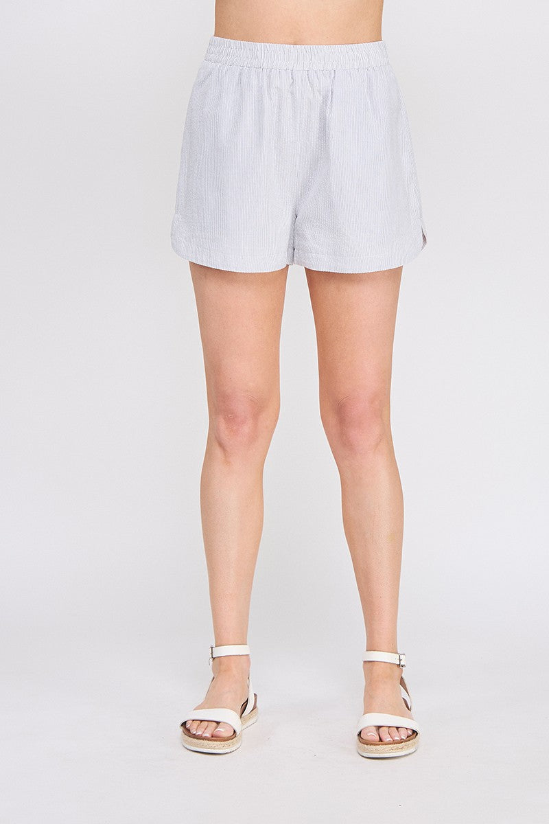 Navy and white pinstripe linen blend shorts with elastic waistband and pockets