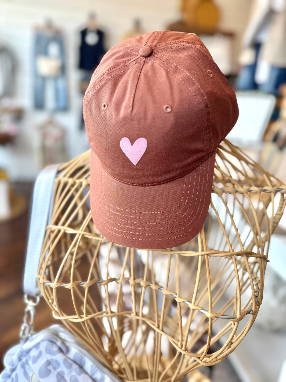 Terracotta women’s adjustable baseball-style hat with pink velvet heart on front panel