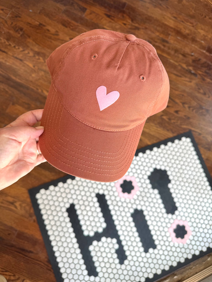 Terracotta women’s adjustable baseball-style hat with pink velvet heart on front panel