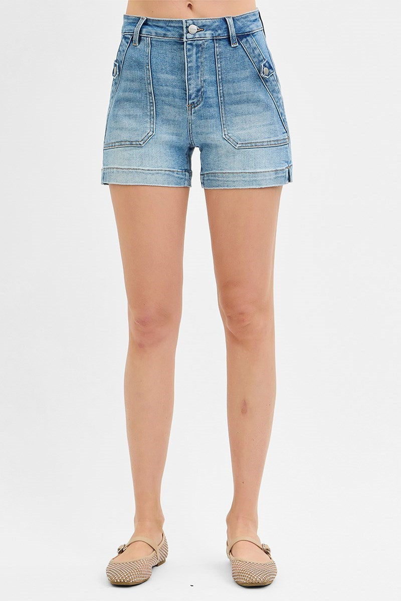 Front view of Risen high rise patch pocket denim shorts in light wash.